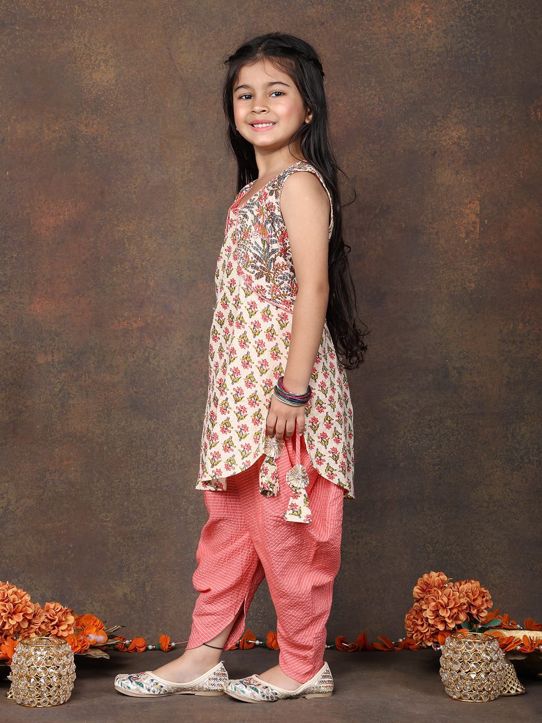Peach Floral Printed sleeveless Kurti  paired with peach Dhoti