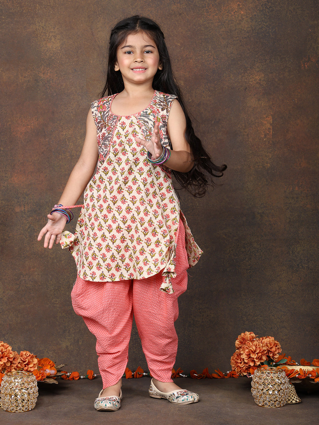 Peach Floral Printed sleeveless Kurti  paired with peach Dhoti