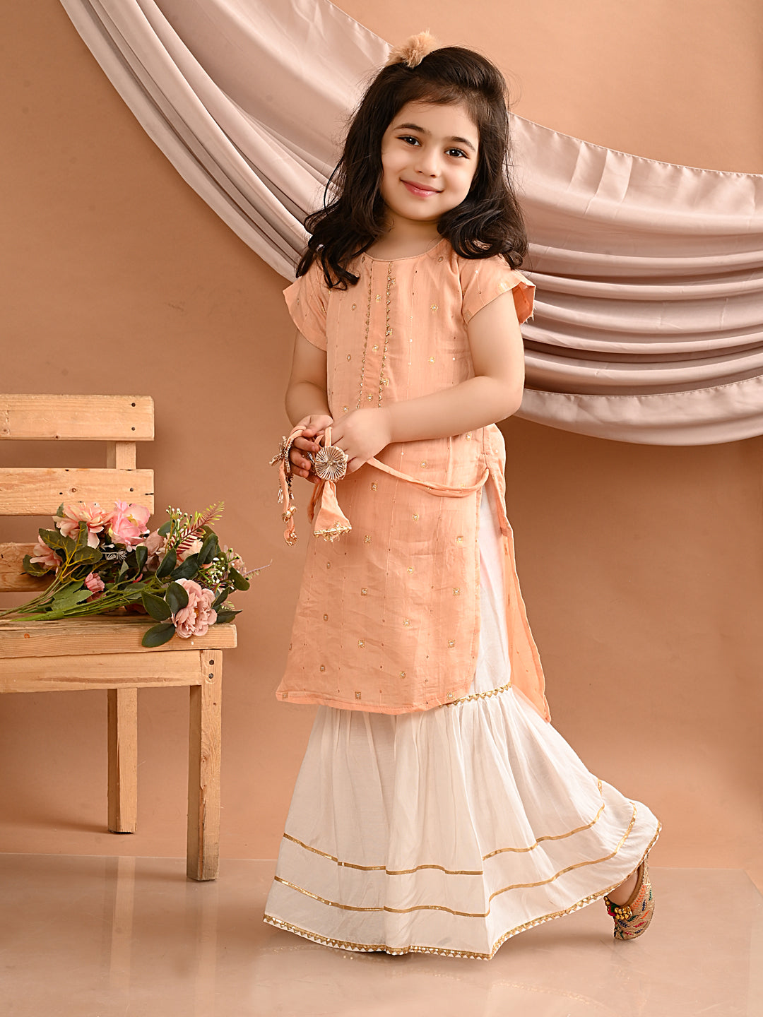 Peach gold embroidered kurti with white sharara