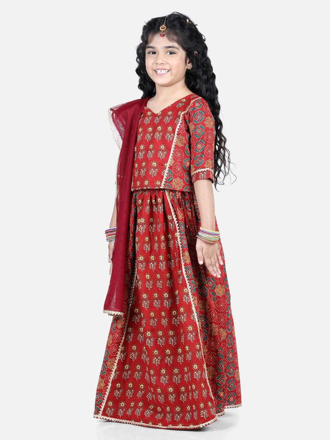 Red motif printed lace embellished top with lehenga and dupatta