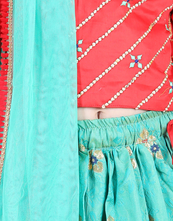 Red brocade top with green lehenga and dupatta
