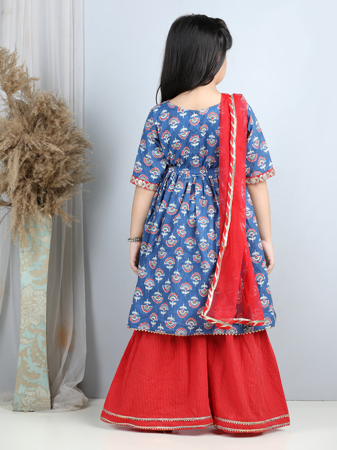 Blue printed kurti with red sharara and dupatta
